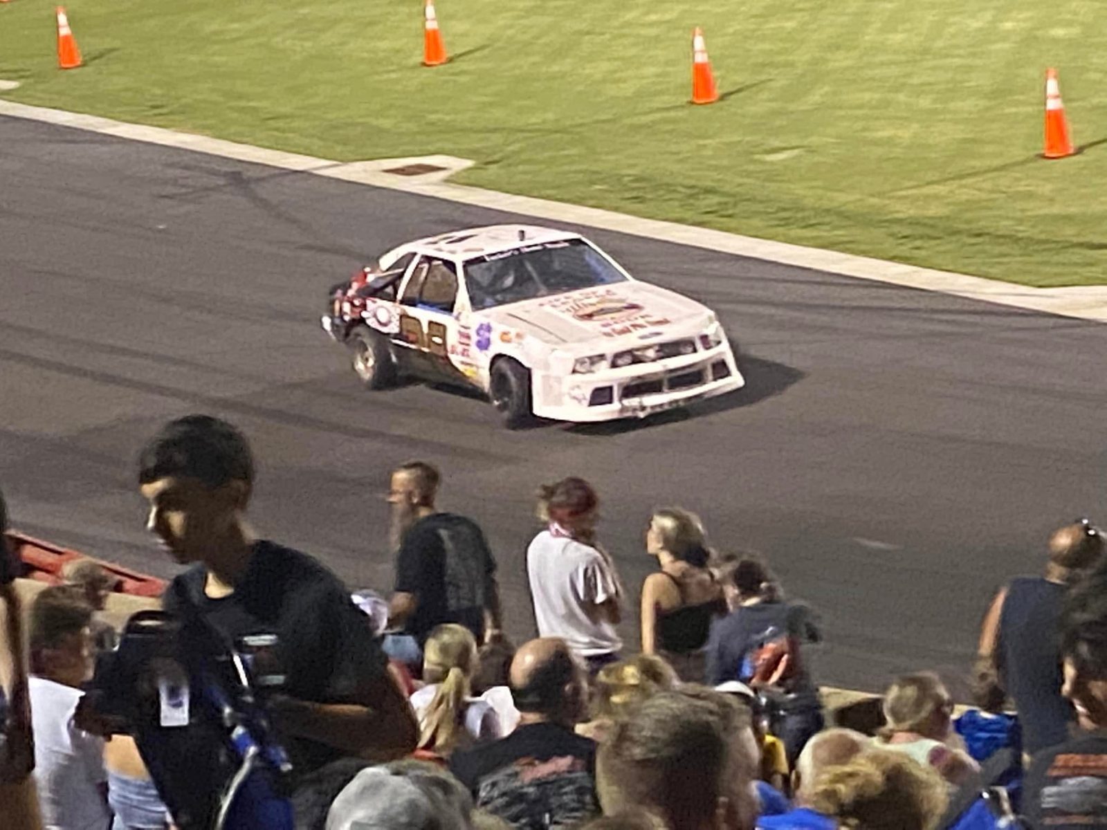 The #28 Stadium Stock car on track with fans in the stands