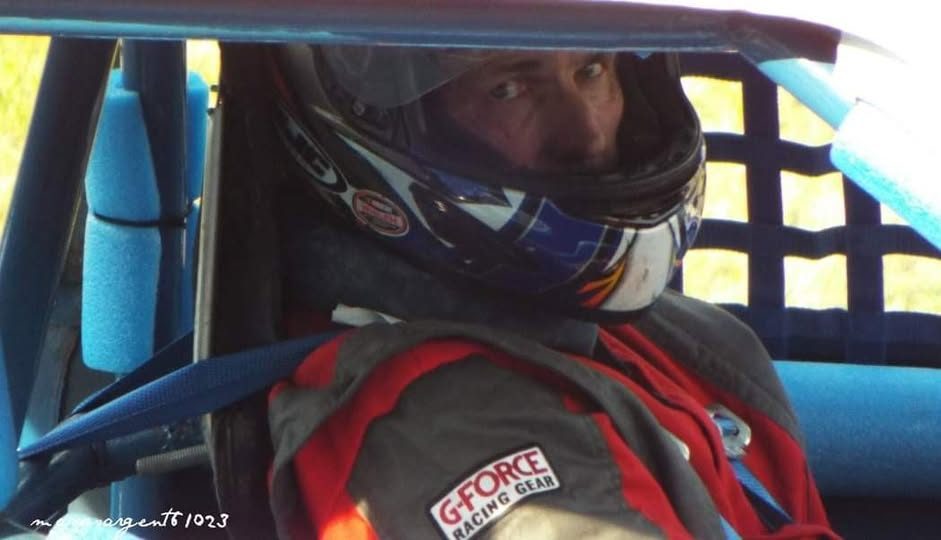 Robert Mabe in the driver seat wearing his helmet